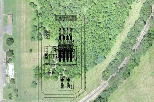 Engineering site plan overlay showing the layout of an electrical substation within a wooded area